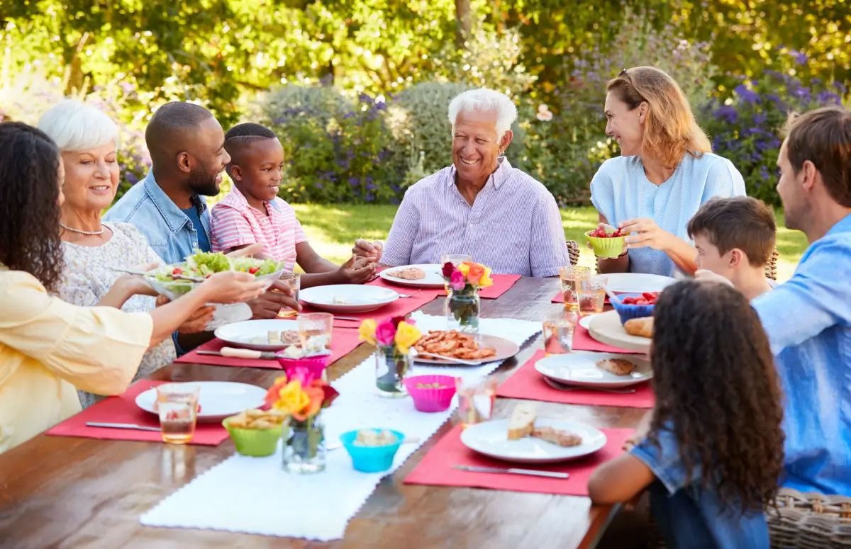 Family eating at an outside table.